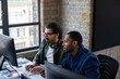 © ReeldealHD images - Coworkers working together on a desktop computer