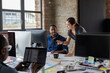 © ReeldealHD images - Coworkers on a video call together in an open plan office