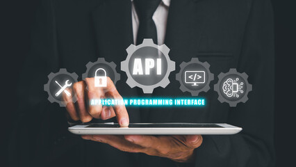 API - Application Programming Interface, Man touching on tablet with VR screen API icon on office desk, Software development tool, modern technology, internet and networking concept.