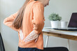© Pormezz - office syndrome, woman with back pain symptoms during work in the office.