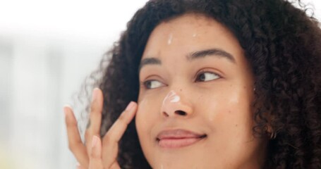 Wall Mural - Skincare, beauty and apply face cream with a satisfied woman doing her morning routine for clear and moisturized skin in bathroom at home. Closeup face of curly hair girl using dermatology product