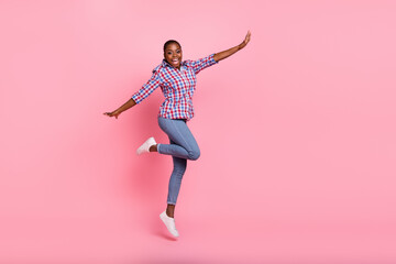 Canvas Print - Full body photo of energetic cheerful lady jumping enjoy good mood isolated on pink color background