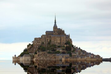 Wall Mural - sea and the famous Abbey of Mont Saint Michel in the North of France