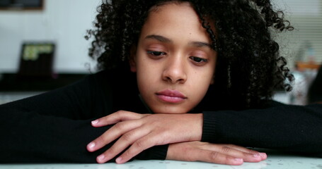 Thoughtful little girl thinking. Mixed race child face close-up