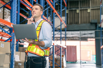 Wall Mural - Smart smiling caucasian warehouse man,worker,manager use laptop to check goods on shelf for product distribution stock management, Logistics shipping business planning concept with copy space