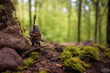 illustration of fantasy dwarf  miniature statue in forest with hairs face close up 3d graphic