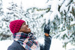 © yurakrasil - happy carefree african american man in warm clothes taking a deep breath in fir forest