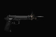 a bullet is fired from a pistol with speed effect in a studio shot on a black background