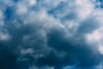 a dark blue cloudy sky. cumulus clouds. nature background. bad weather forecast. before a thundersto