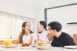 © gballgiggs - Happy asian family and having fun during eating meal together at home