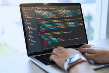 Digital technology, software development, IoT concept. Woman programmer, software developer working on laptop computer and smart city with big data, programming code.