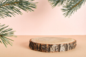 Canvas Print - Wooden podium for the presentation of eco-products. Sawed down a tree and a pine branch