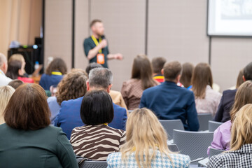 Wall Mural - audience listens to the speaker at conference