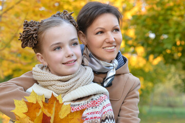 Poster - Portrait of nice mother of daughter in autumn