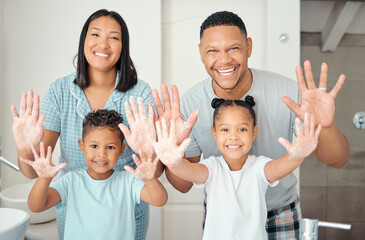 Poster - Parents, children and cleaning hands as a happy family in a bathroom together at home with a proud mother and father. Smile, dad and healthy mom enjoys a wellness and cleanliness lifestyle with kids