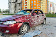 Damaged and destroyed civilian car with shrapnel holes from Russian missile in a war zone in Kharkiv, Ukraine