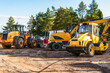 © graja - Heavy industrial machinery at construction site parking area