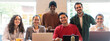 © Davide Zanin - Horizontal banner or header with smiling multiethnic coworkers looking at camera making team picture in modern office together - Diverse work group or department laugh posing for photo at workplace