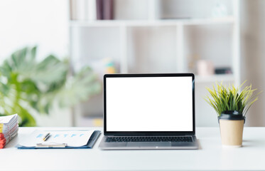 Modern computer,laptop with blank screen on wood table with office window view backgrounds