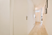 Empty Hallway With White Walls And Doors In Villa