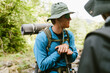 © Drobot Dean - White young travelers wearing backpack hiking in forest