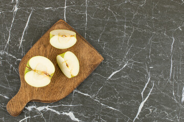 Wall Mural - Sliced green apple. organic green apple on wooden board