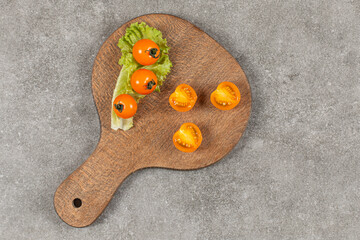 Wall Mural - Top view of fresh half cut and whole tomatoes