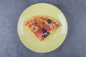 Wall Mural - Top view of margarita pizza slice on yellow plate