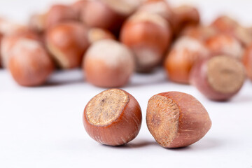 Wall Mural - Shelled hazelnuts on the white background