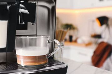 Poster - Modern coffee machine with cup of tasty drink in kitchen, space for text