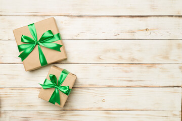 Gift boxes on wooden background, top view