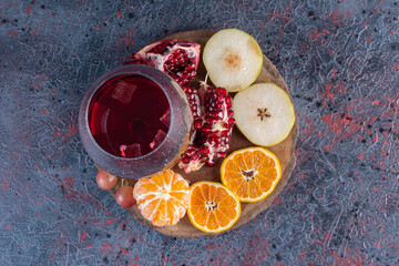 Wall Mural - A glass of pomegranate juice with fresh fruits