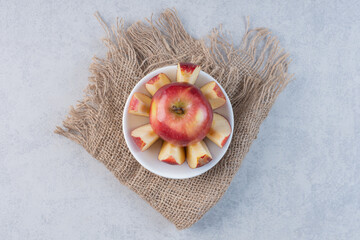 Wall Mural - Fresh apple fruit with whole or cut pieces on grey background