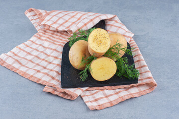 Wall Mural - Boiled new potatoes seasoned with dill and butter. Top view