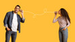 © Prostock-studio - Romantic Arab Couple Communicating Through Tin Phone Over Yellow Background