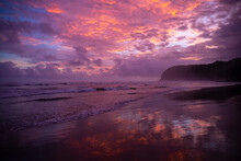 Amazing Purple Sunset On A Tropical Beach In Costa Rica With Rough Ocean And Cliffs In The Background, Costa Rica Pacific Coast, Playa San Miguel