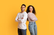 © Prostock-studio - Portrait Of Cheerful Middle Eastern Man And Woman Posing Over Yellow Background