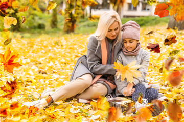 Poster - Happy family on autumn walk Mother and daughter walking in the Park and enjoying the beautiful autumn nature.