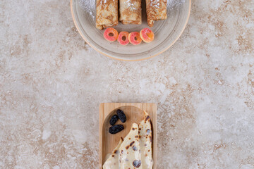 Wall Mural - Homemade pancakes roll with raisin and sugar powder