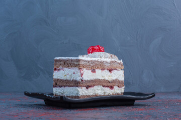 Wall Mural - Cherry topped cake on a platter on abstract background