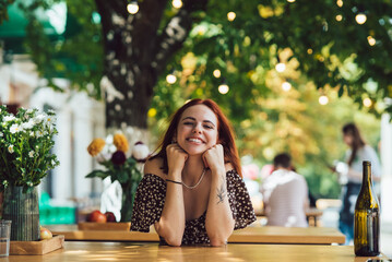 Close-up portrait of two female at summer street cafe