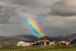 Strong Colorful Rainbow over a typical Icelandic Farm in Iceland