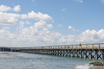 Sticker - Wooden pier by the beach and ocean in the summer