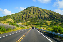 Road Leading To The Green Slopes Of The Koko Crater In The Suburbs Of Honolulu On O'ahu Island In Hawaii - Steep Ridges Offering Great Hikes Over The Pacific Ocean