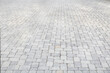 light grey brick road or driveway in one point perspective road side view