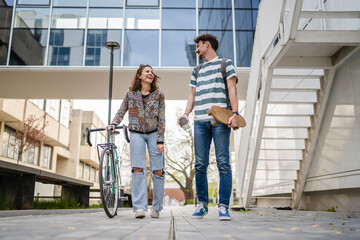 modern couple man woman male and female student talk in day outdoor