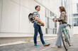 © Miljan Živković - modern couple man woman male and female student talk in day outdoor