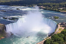 Aerial View Of Horseshoe Falls Including Maid Of The Mist Boat Sailing On Niagara River, Canada And USA Natural Border