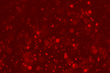 Red glitter vintage lights background.  red bokeh shiny on dark background.