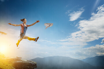 Wall Mural - Young woman jumping in the air